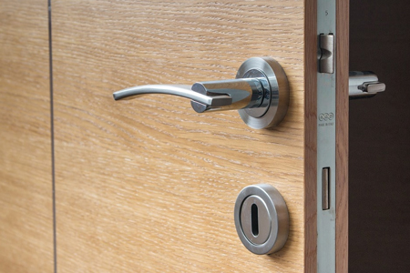 Picture of a lock and latch in a door frame