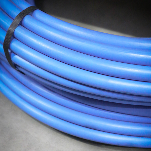 Coil of blue MDPE water pipe