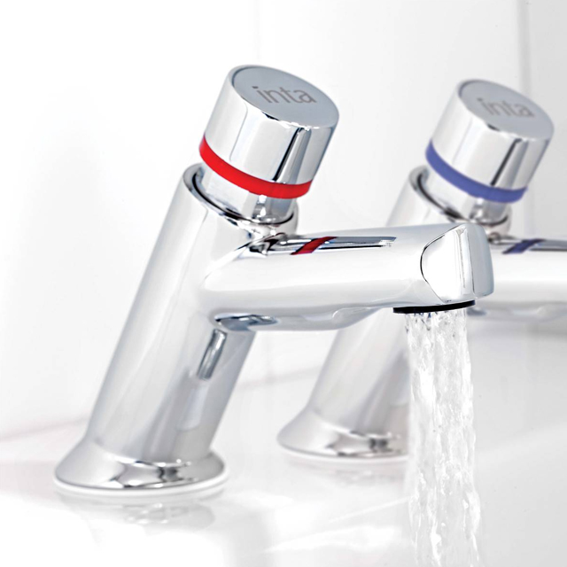 Picture of a pair of press top basin taps