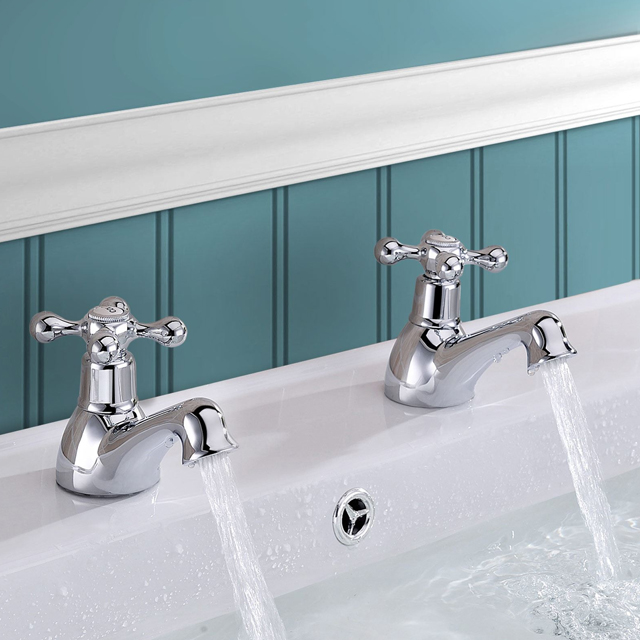 A picture of a pair of traditional bath taps