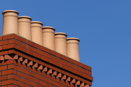 Picture of multiple chimney pots on top of a chimney