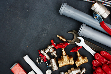 Picture of various plumbing tools & parts