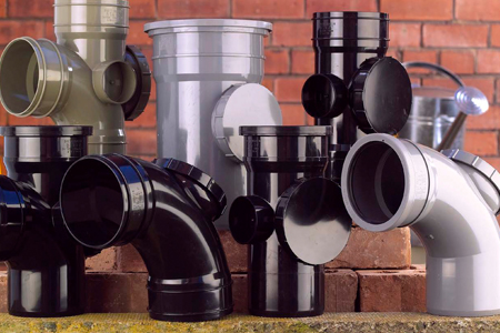 Picture of various sizes and colours of soil pipe