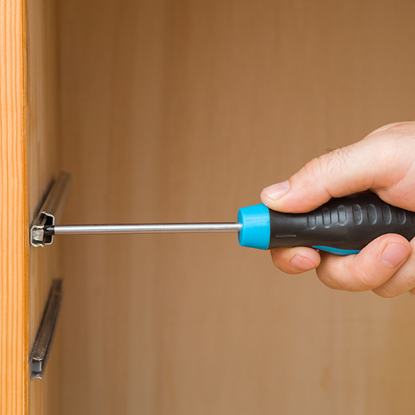 Picture of a person using a screwdriver