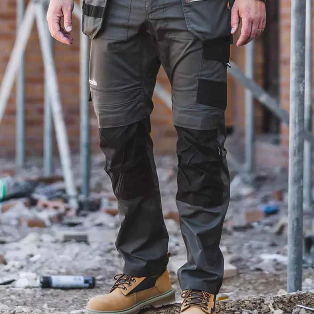 Picture of a man in workwear trousers